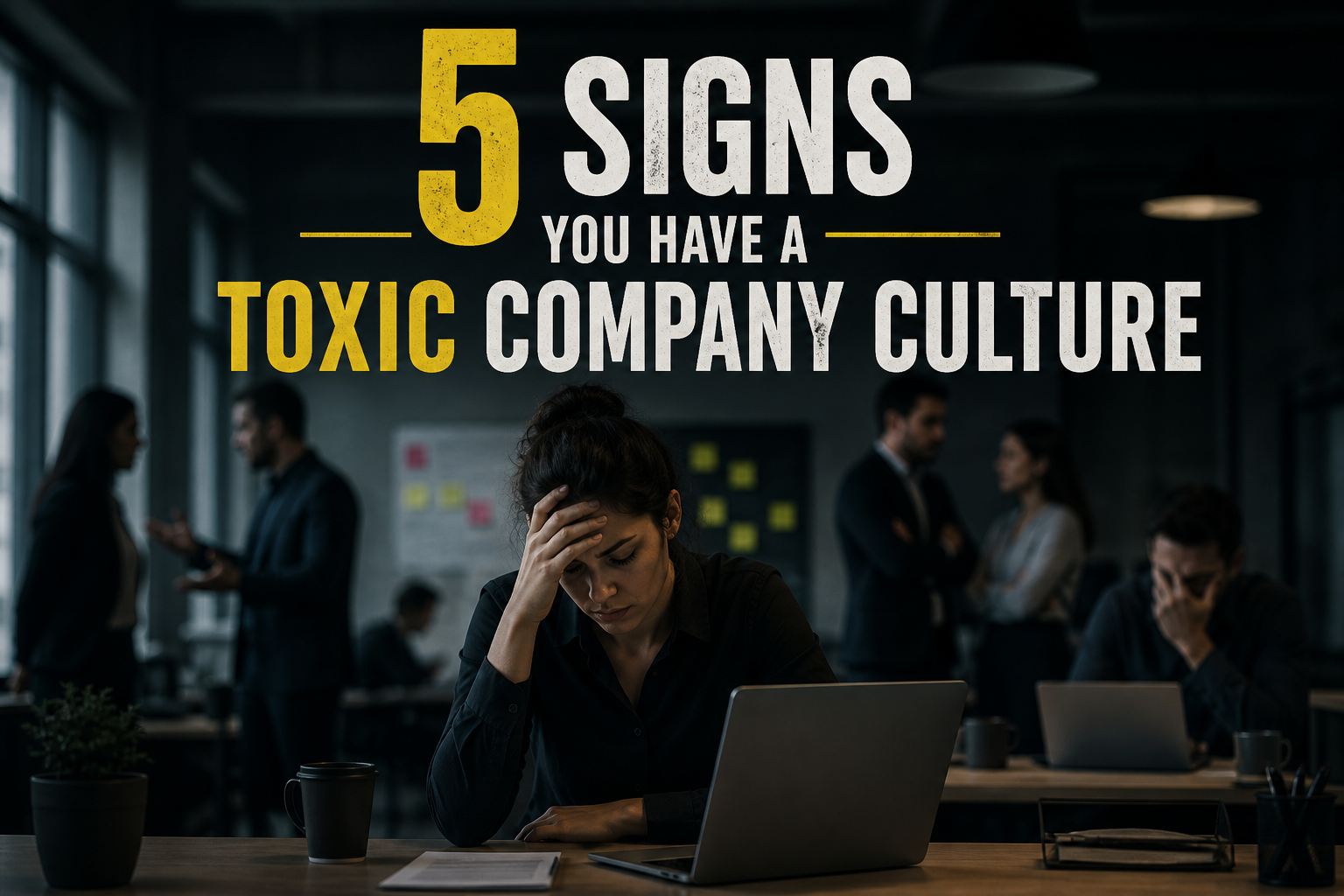 Stressed employee sitting at a desk in a dark office while coworkers appear tense in the background, representing the warning signs of Toxic Company Culture.