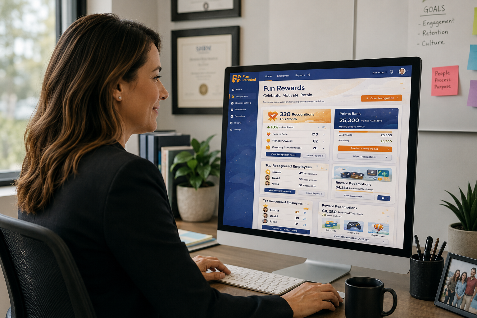 **Title: Alt Text** An HR manager works at her desk while reviewing an employee recognition dashboard, illustrating how employee engagement helps HR manage recognition, retention, and workplace culture.